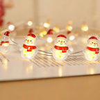 Red Scarf Snowman fairy string lights with warm LEDs for indoor seasonal decor, battery operated, 10 ft, 30 LED